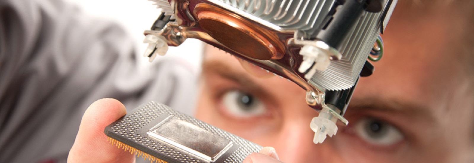 Engineer inspecting an electronic component